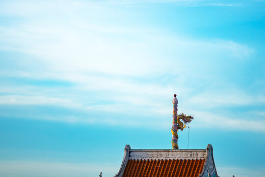 Traditional Asian Roof with Ornate Decor and Sky