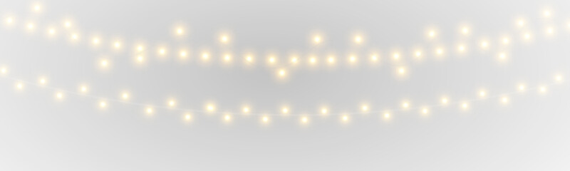 Obraz premium Elegant golden fairy lights with luminous bulbs and twinkling sparkles bring warmth to festive compositions. PNG transparent background ensures easy integration.