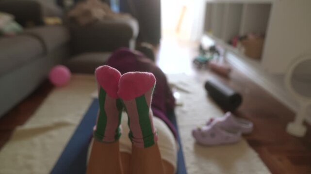 Soft light illuminates feet in peaceful exercise setting at home