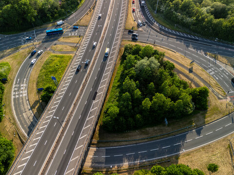 Aerial view of highway interchange with cars and trees