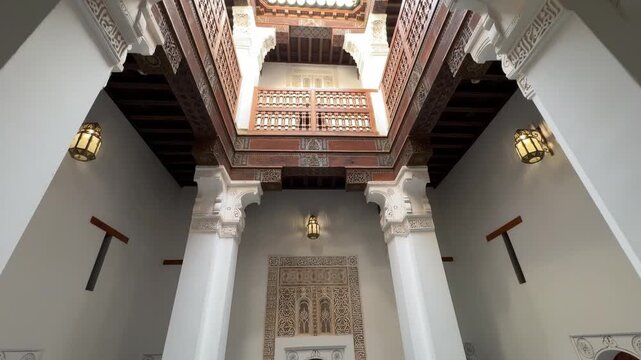 Intricate carved stucco and wood details at Ben Youssef Madrasa Marrakech
