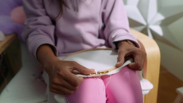 Serene scene of young child engaged in mindful embroidery craft session