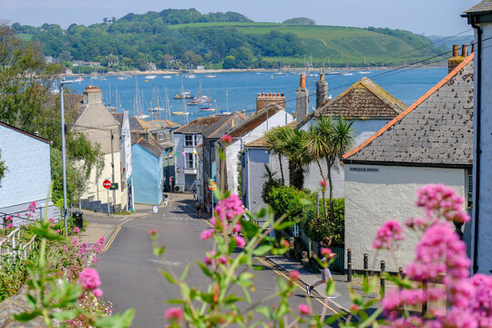 A view down through Falmouth to the bay with boats moored on a summers day.