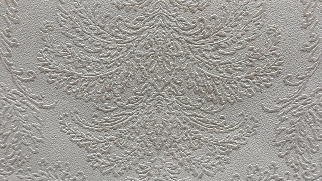 Luxurious classic ornament embossed on light gray fabric texture backdrop for interior design