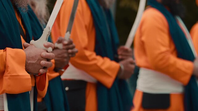 Indian soldiers with swords Kirpan praying for the Vaisakhi religion parade