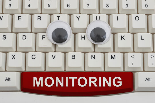 Monitoring text with googly eyes on a white computer keyboard for tracking user activity