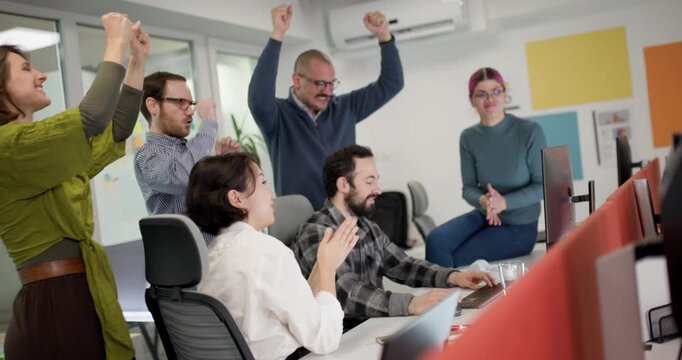 Team members discuss ideas in a modern office space as they work together on a project during a weekday afternoon