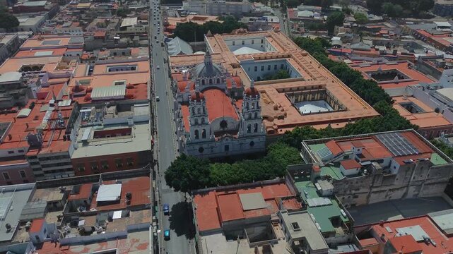 Expiatorio del Espiritu Santo Church Rooftop Architecture with Historic Downtown Buildings Skyline and Colonial Houses During Daytime Aerial Travel In Drone POV in Puebla Mexico