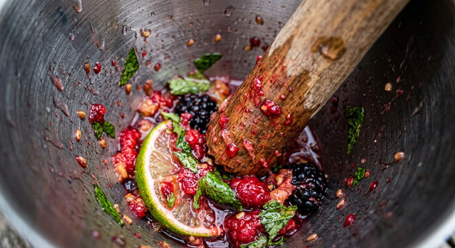 Fresh Berry and Lime Cocktail Muddle in Rustic Metal Bowl