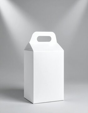 White carton box with handle on gray studio floor, blank packaging mockup, delivery container, product branding template