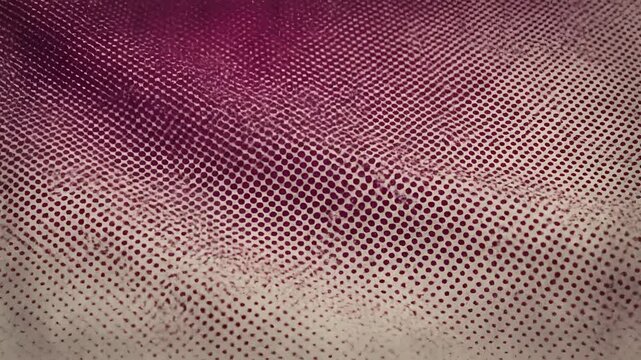 Closeup of a textured fabric with a gradient of purple to beige.