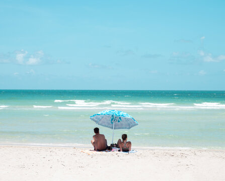 couple beach umbrella miami florida