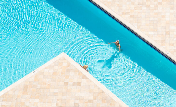 aerial drone woman people pool relaxing miami florida