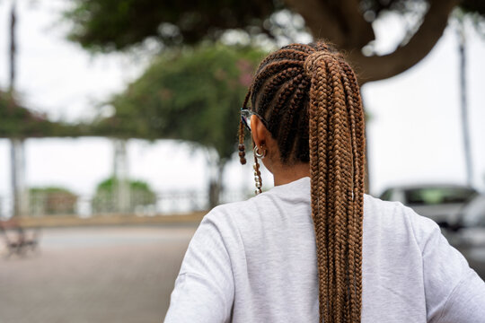 Woman with box braids walking outdoors