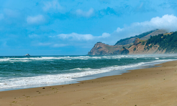 Oregon coast with haze and wind.