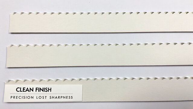 Close-up of Textured Paper Edges with Perforated Lines