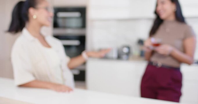 Diverse women pals talking at island fruit bowl cueing camera panning woman joining chat with mug