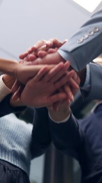 Below, business and people with handstack in office for good news, real estate success or celebration. Staff, applause and team achievement for property deal, realtor motivation and auction milestone