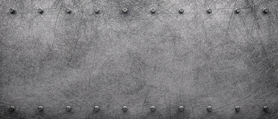 Dark grunge scratched metal texture background with iron rivets.