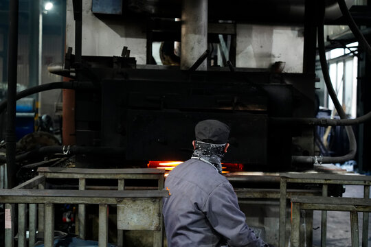Worker Operating in Metal Forging/Heat Treatment Workshop