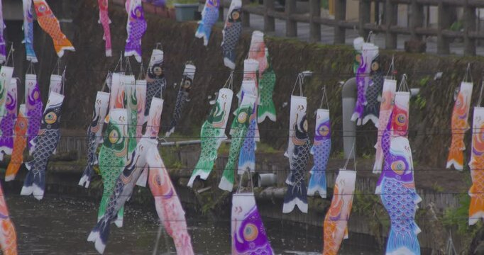 Carp streamers swaying in the wind near the brook at the traditional town