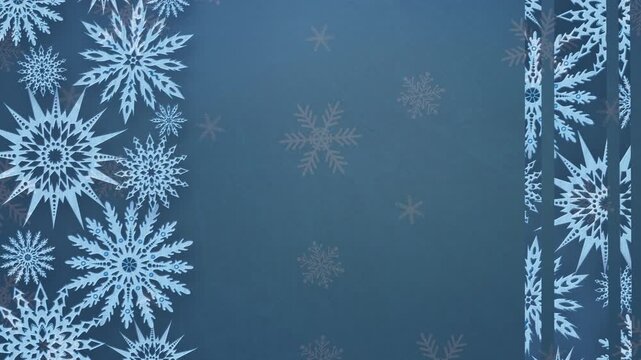 Elegant blue winter background featuring intricate snowflake patterns framing a minimalist blank copy space.