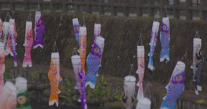 Carp streamers swaying in the wind near the brook at the traditional town