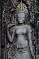 Apsara dancer carved into stone at Angkor Wat, Bayon Temple, Siem Reap, Cambodia. These celestial dancers are a common motif in Khmer art and architecture. © Zenstratus