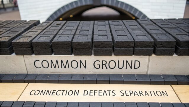 Stone Blocks with 'Common Ground' and 'Connection Defeats Separation' Text