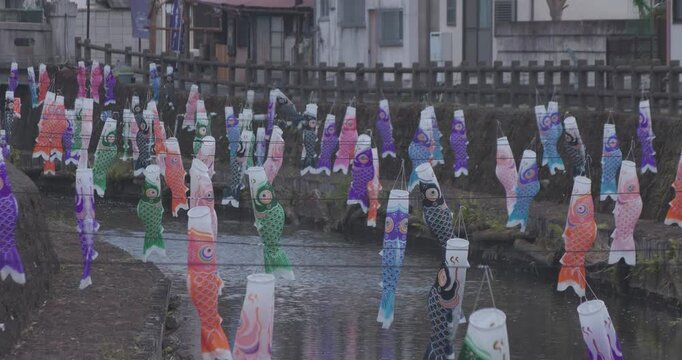 Carp streamers swaying in the wind near the brook at the traditional town