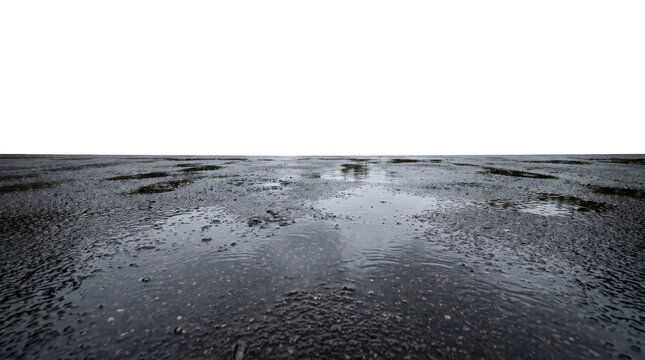 Wet road surface with central water trail on black background