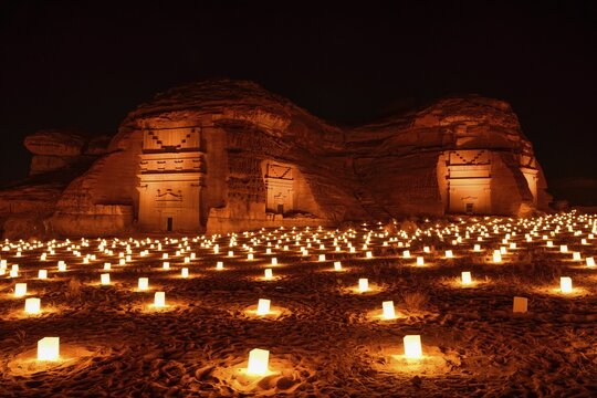 Illuminated Nabataean tombs at night, Hegra or Mada'in Salih, AlUla region, Medina province, Saudi Arabia, Arabian Peninsula