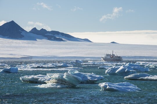 Cruise ship behind icebergs, Brown Bluff, Tabarin Peninsula, Antarctica