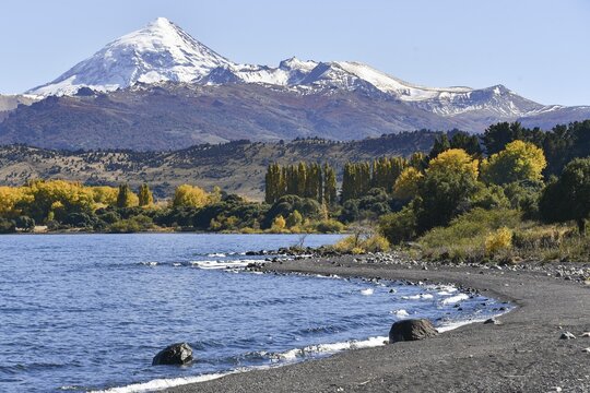 Lake Lago Lolog in autumn with the snow-covered volcano Lanin, Ruta 40, San Martin de los Andes, Patagonia, Argentina