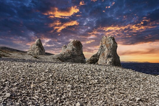 Dolomite rock pillars, petrified trolls, dramatic evening sky, Trollholmen, Trollholmsund near Lakselv, Porsangerfjord, North Cape, Finnmark, Norway