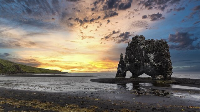 Basalt rock Hvitserkur, Elephant Rock on lava beach, dramatic evening sky, Vatnsnes Peninsula, H&uacute;nafj&ouml;r&eth;ur, North Iceland, Iceland