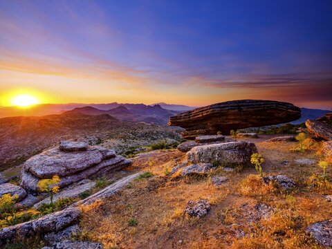 Sombrerillo limestone rock formations at sunrise, El Torcal nature reserve, Torcal de Antequera, Malaga province, Andalusia, Spain