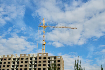 Fototapeta premium Outdoor day photography of a construction site showing a heavy lift crane arm extended