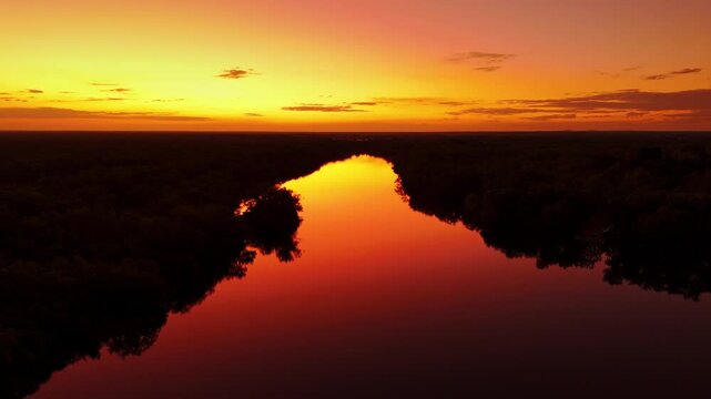 Aerial River Reflecting Vivid Red Orange Sunset Dramatic Sky Yellow Water Billabong Kakadu Australia