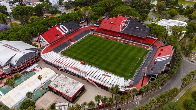 Rosario, Argentina - November 1, 2025: Aerial view of Marcelo Bielsa Stadium, showing red and black stands with seat art honoring Lionel Messi and Maxi Rodriguez, situated within Parque Independencia