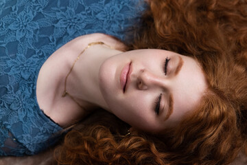 Naklejka premium Woman lying down with closed eyes, finding serene sleep and tranquil rest