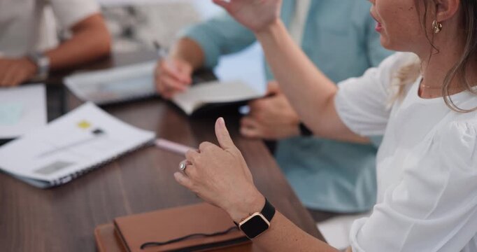 Hands, woman and talk with staff in office for discussion, planning and article feedback. People, explain and team listening to advice, brainstorming and communication with publication tips for story
