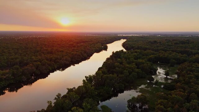 Aerial River at Golden Sunset with Sun on Horizon Yellow Water Billabong Kakadu National Park