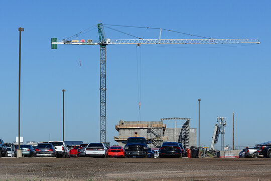 Tower crane positioned at an infrastructure water pipe rehabilitation project, representing utility upgrades, construction support, and public infrastructure improvement operations