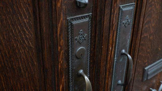 Masonic Square and Compass Door Escutcheon with Brass Pull Handle on Antique Oak Door, Trenton New Jersey