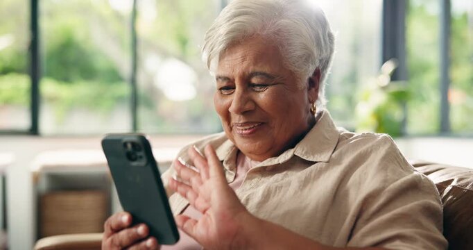 Old woman, smartphone and video call conversation at house, communication and wave with laughing. Senior person, funny story or virtual chat with phone for talking with happiness in retirement home