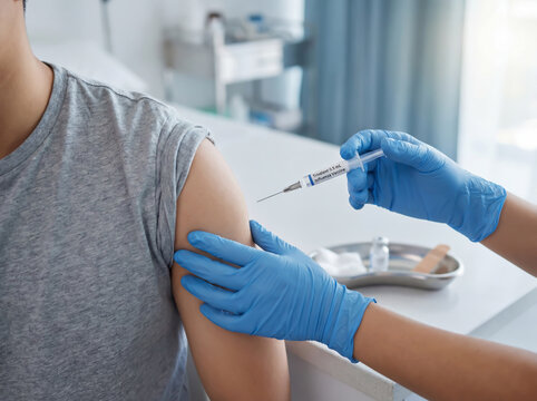 Patient receiving a trivalent influenza vaccination in a clinical setting