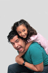 Fototapeta premium 40-year-old divorced single dad and his Latina daughter play and have fun to celebrate Father's Day