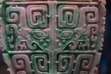 Intricate ancient jade carving with traditional spiral patterns © Hazel