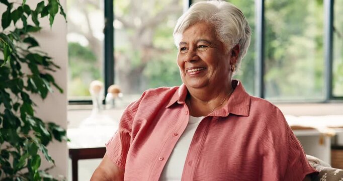 Smile, thinking and elderly woman in living room, remember happy memory and past reflection for nostalgia. Positive mindset, retirement and senior person in home with daydream, perspective and laugh